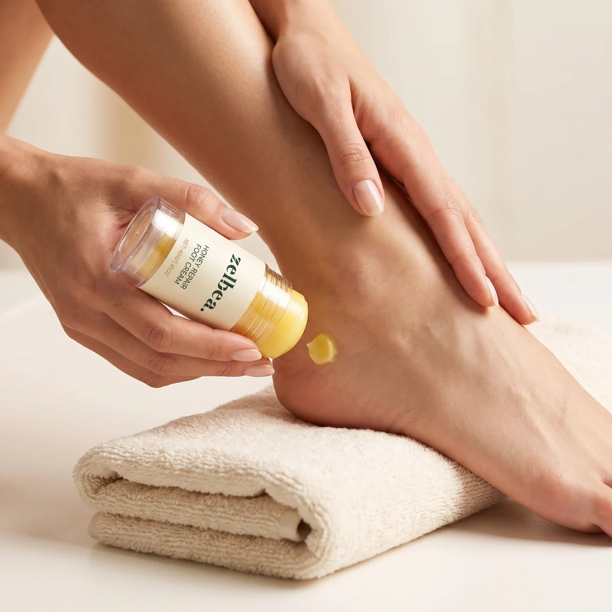 Applying Zelbea honey repair foot cream to a soft, healthy heel